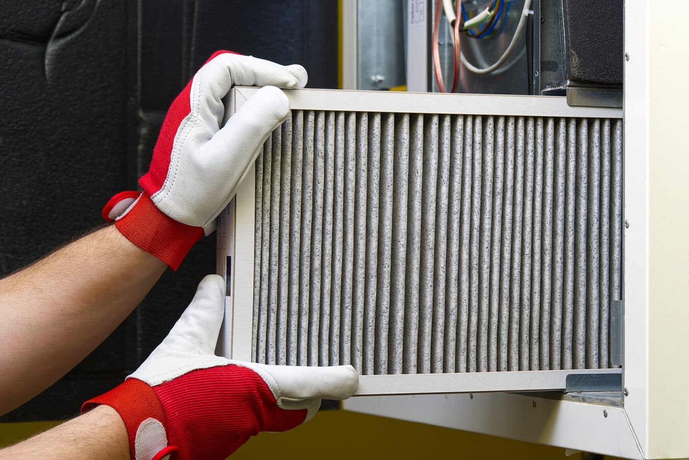 Replacing Dirty Air filter for home central air conditioning system.