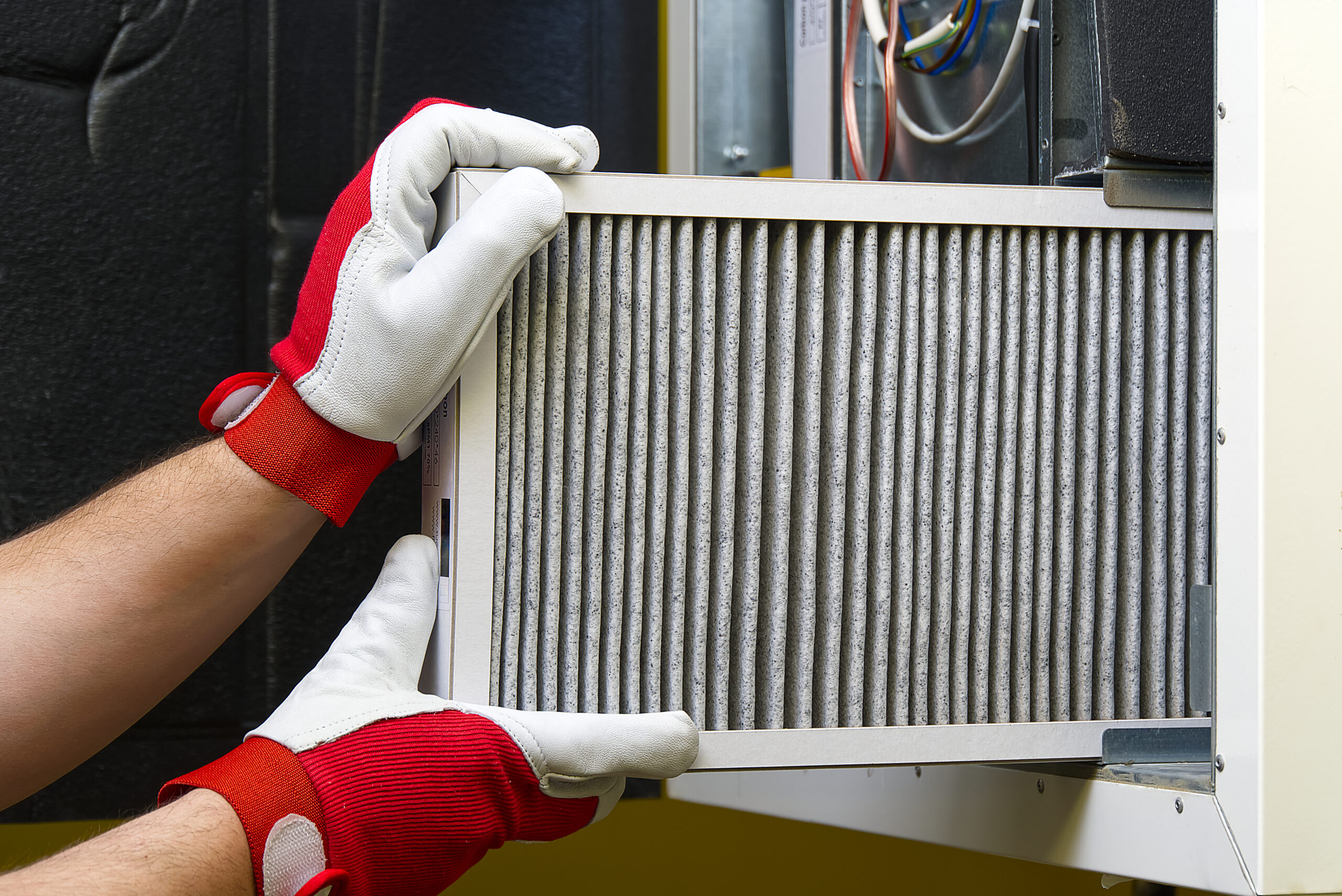 Replacing Dirty Air filter for home central air conditioning system.